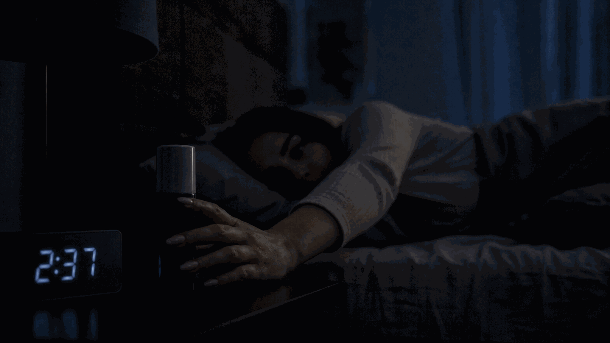 Reaching for the bottle on the nightstand in the dark